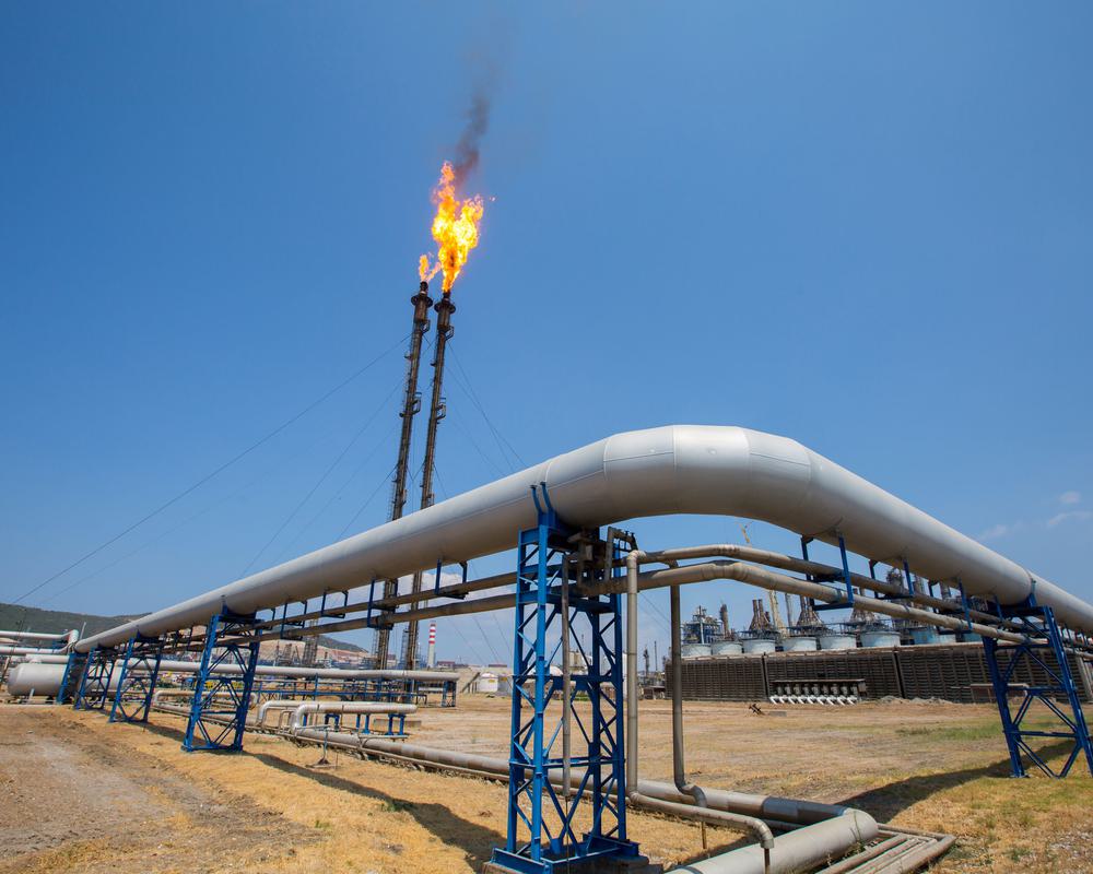 Pipelines wrap around an ignited flare tip